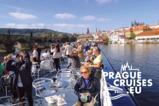 Sightseeing cruise through the historic heart of Prague – Tourists on the sundeck